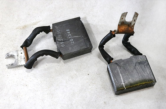 worn servo motor brushes that were replaced during the servo motor repair process